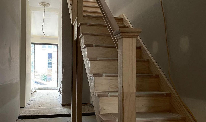 Wooden staircase in process of being renovated.