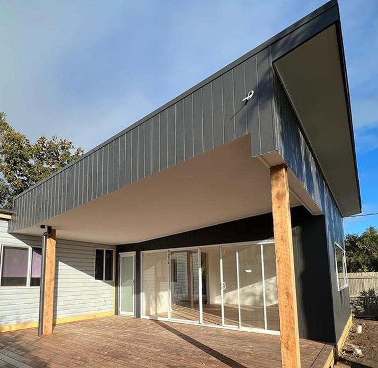 Extension deck on weatherboard home.