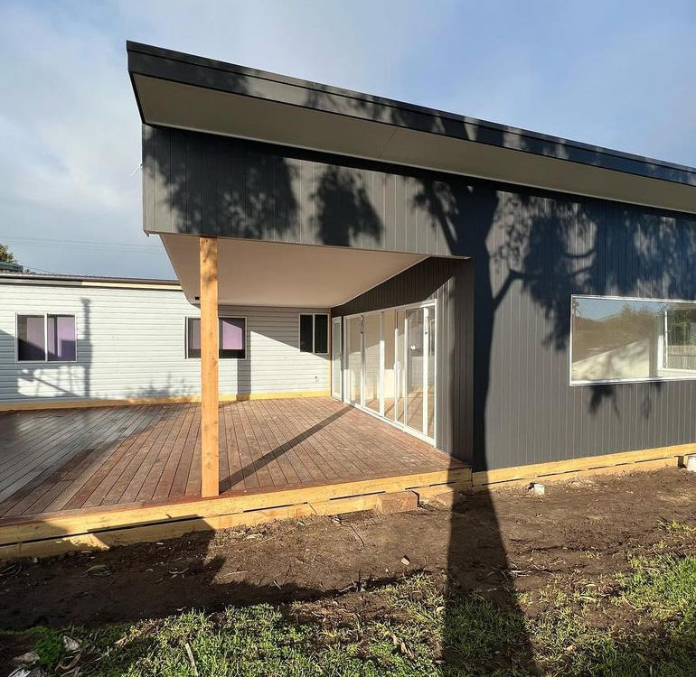 Extension deck on weatherboard home.